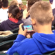 Illustration for article titled Bored Baseball Fans Play Baseball Video Games At Baseball Game